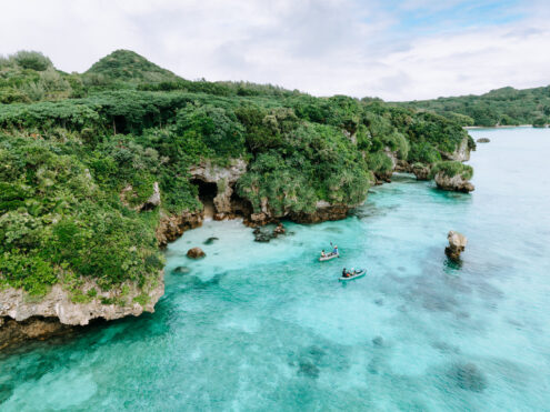 Tropical lagoon packrafting, Japan off-the-beaten-path drone photography by Ippei and Janine