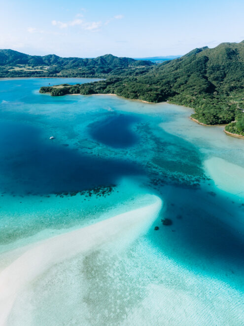 Blue lagoon with sandbar, tropical Japan off-the-beaten-path drone photography by Ippei and Janine