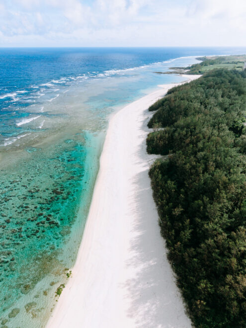 White sand beach, turquoise water and coral reef, Tokunoshima Island, Kagoshima, Japan off-the-beaten-path drone photography by Ippei and Janine