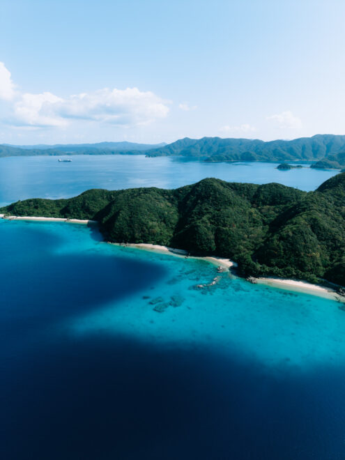Deserted tropical beach, turquoise water and mountain, Kakeroma Island, Amami Islands, Japan