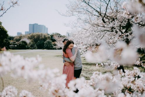 Tokyo surprise proposal with cherry blossoms - Japan engagement photography by Ippei and Janine