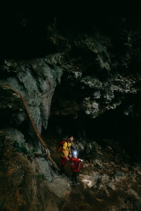 Exploring limestone caves, Japan family outdoor adventure photography by Ippei and Janine