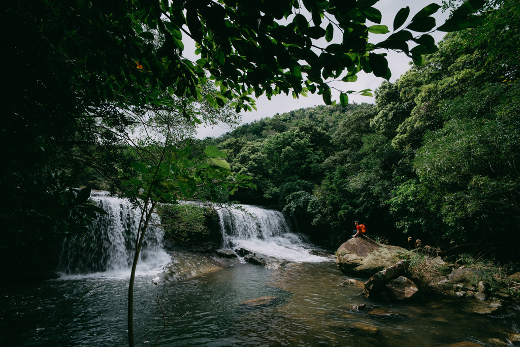 Admiring waterfalls of Iriomote, Yaeyama Islands, Okinawa, Japan
