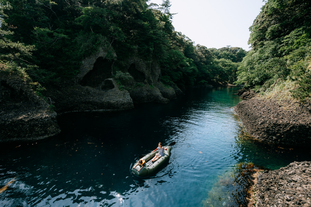 Kayaking through sea inlet of Sado Island, Niigata, Japan
