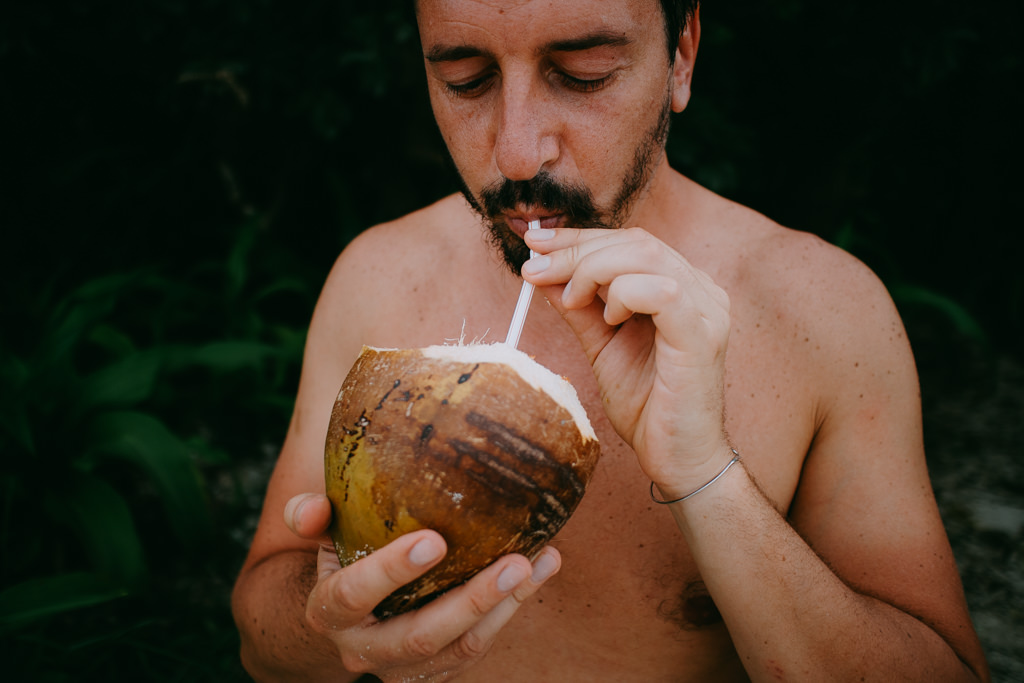 Drinking wild Japanese coconut juice, Ishigaki Island, Tropical Japan